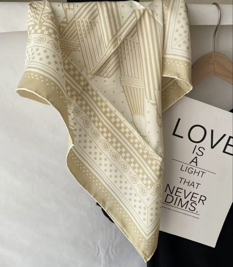 Wrap yourself in understated luxury with our 65×65cm silk scarf, crafted from 100% premium mulberry silk
